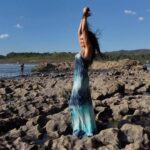 Tia Carrere Instagram - Soaking up the sun, playing with drones, in my beautiful @michellejonasdesigns dress… @pedebevec #drone #dronephotography #dronestagram #dronevideo