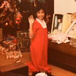 Tracie Thoms Instagram - On this Christmas morning, I hope you’re all as happy as this kid was when Santa brought her a Preemie from the Cabbage Patch! Her name was Kimberly, and she was perfect! Her older sister Carrie was just strewn on the ground at my knees, overwhelmed with the joy of meeting her little sister! (We took this all so seriously. Much like we did that garland on the tree. These kids today will never know…) Thanks to my amazing mother, Mariana Thoms, who had the foresight to hold on to these gems, cuz I still have these babies with me to this day… Merry Christmas, y’all! #cabbagepatchkids #80schristmasjoy