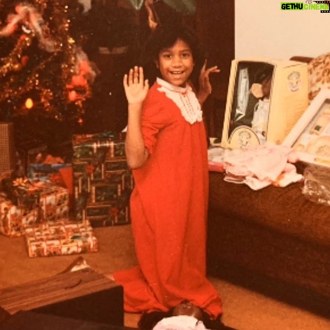 Tracie Thoms Instagram - On this Christmas morning, I hope you’re all as happy as this kid was when Santa brought her a Preemie from the Cabbage Patch! Her name was Kimberly, and she was perfect! Her older sister Carrie was just strewn on the ground at my knees, overwhelmed with the joy of meeting her little sister! (We took this all so seriously. Much like we did that garland on the tree. These kids today will never know…) Thanks to my amazing mother, Mariana Thoms, who had the foresight to hold on to these gems, cuz I still have these babies with me to this day… Merry Christmas, y’all! #cabbagepatchkids #80schristmasjoy