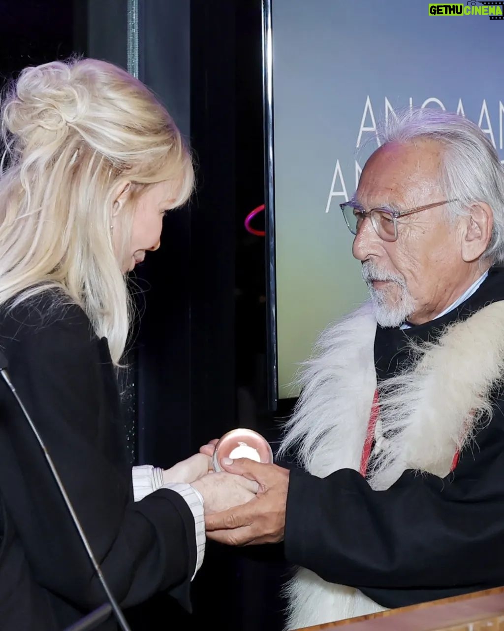 Trudie Styler Instagram - đ The Visionary: Angaangaq Angakkorsuaq @angaangaq_. Presented by @trudiestyler âAn innovative thinker who can see the path to a better worldâ The Visionary honour goes to Angaangaq Angakkorsuaq, Inuit Kalaallit elder and storyteller from Greenland and carrier of the Qilaut (wind drum). As a advocate for the environment and Indigenous issues, he has lectured and participated in events in 70 countries in the world. His spiritual task - given by his mother - is to "melt the ice in the heart of men". It may be difficult to grasp and we tend to shut down when we hear scientists tells us that today the Greenland ice cap is losing an average of 30m tonnes of ice an hour due to the climate crisis, melting faster than most scientists predicted.  As Angaangaq says: We canât plant ice - when itâs gone itâs gone. But we can protect it.  Find out more on greencarpetfashionawards.com #GreenCarpetFashionAwards