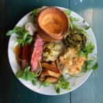 Ulrika Jonsson Instagram - Last night’s roast. Cote de Boeuf. Creamy, garlicky leeks. Cauli Cheese - always with Lancashire cheese. Always. Yorkshires. Spring greens in butter and wholegrain mustard. Then, to cause some upset: beef dripping chips because that’s what I had. Horseradish. Gravy, baby.