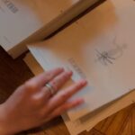 V. E. Schwab Instagram - How do you sign all those books? The same way I write them. One page at a time. (And also while bingeing TV shows, so please send me your recs.) #veschwab #addielarue #shadesofmagic #threadsofpower #vicious #writing #advice #creativity