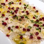 Valentine Thomas Instagram - Food 😍 1- happy place 2- oysters on the grill 3- amberjack crudo, pomegranate, fennel 4- grilled oysters, Asian mignonnette, my dirty fingers 5- hasselback potatoes, anchovy cream 6- Cured gag grouper, smoked crème fraîche, capers 7- Turkish eggs 8- Butter clams 9- scallops carpaccio, cayenne, honeydew, ginger