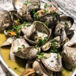 Valentine Thomas Instagram - Food 😍 1- happy place 2- oysters on the grill 3- amberjack crudo, pomegranate, fennel 4- grilled oysters, Asian mignonnette, my dirty fingers 5- hasselback potatoes, anchovy cream 6- Cured gag grouper, smoked crème fraîche, capers 7- Turkish eggs 8- Butter clams 9- scallops carpaccio, cayenne, honeydew, ginger