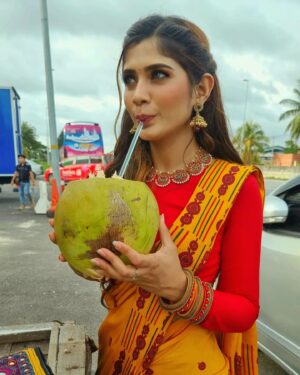 Vanessa Cruez Instagram - Nothing is more refreshing than a change of environment, silence and a coconut on your hand..😝😝

Attire & Accessories by: @yoginiecollections

#vanessacruez #vanessa #smile #posing #traditional #saree #orange #red #pink #yellow #longhair #instapic #instagood #insta #instafashion #blessed #vannessa #stayblessed #happiness #stayhappy #spreadlove #positive #positivity #messyhairdontcare #love #simple #indiangirl #coconut