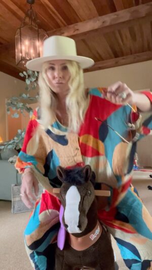 Vanessa Evigan Instagram - Let me just say I have a WHOLE new respect for my kids. That dang horse jumps right out from under you if your not prepared. Had my little helper take my morning pool button down outfit that costs only $29 to an evening look. Just throw a belt in the car and a cute pair of shoes and don’t go home 😜 I’m making a new “highlights” labeled “under $50” so you can find this cute coverup/dress and many more there!