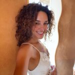 Vanessa Rubio Instagram – During my summer travels I hit a place where my being forced me to look for solitude and retreat. I just needed to ground into some new energy that was emerging. @suryalilayoga retreat center in Spain was a haven 🤍 in this beautiful place there is a yoga room called the Moon Shala. I did a deep breathwork session, releasing, crying, laughing, held by the magnificent healing energy of this space. To feel fully is our birthright 🤍🤍🤍 and thankfully there are so many free modalities that we can do to help us through hard moments of transition. Breathwork is completely free and profound, there are so many videos on @youtube ✨Have you been having any breakthroughs lately? How have you seen yourself through?