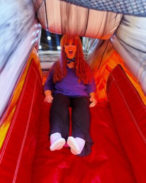Wynonna Judd Instagram - “This ain’t her first rodeo, it’s her second!” 🤠🐴🥳 Had the best time celebrating my girl’s 2nd birthday over the weekend with the best friends, family & support system we could ask for!

(Yes, there was an inflatable slide, and yes, Nonie participated). 🤘🏼

  special thanks to @rmmcake for always bringing my cake vision to life! 🎂🐮