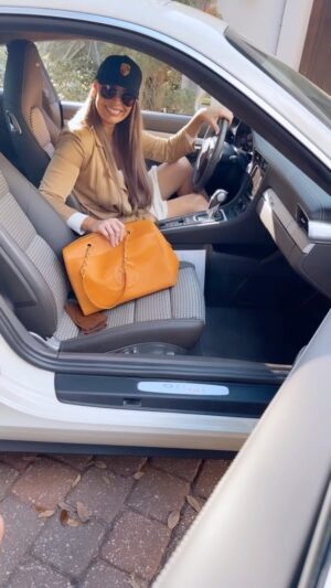 Yoanna House Instagram - An honor to be a Model Ambassador & Style Expert for @underwood_jewelers , the best jeweler in the South since 1928. A huge honor to work in the Jacksonville community representing the most excellent. Perfectly styled with Porsche 911 
50th Anniversary @porschejacksonville

•Director of Photography @chasejelliott 
•Videographer & Marketing Director
@samantha_shakes of @studiosvntn 
•MAKE-UP & HAIR
@dior_at_towncenter Justin Hart @muaforlife88
•BTS Videographer Social Media 
@collinbshakes 
Set designer @cinder.elliott
Catering @sushiwill25 
Trainers @finallapshop 
CHANEL brown and Orange bag @cutconsignment