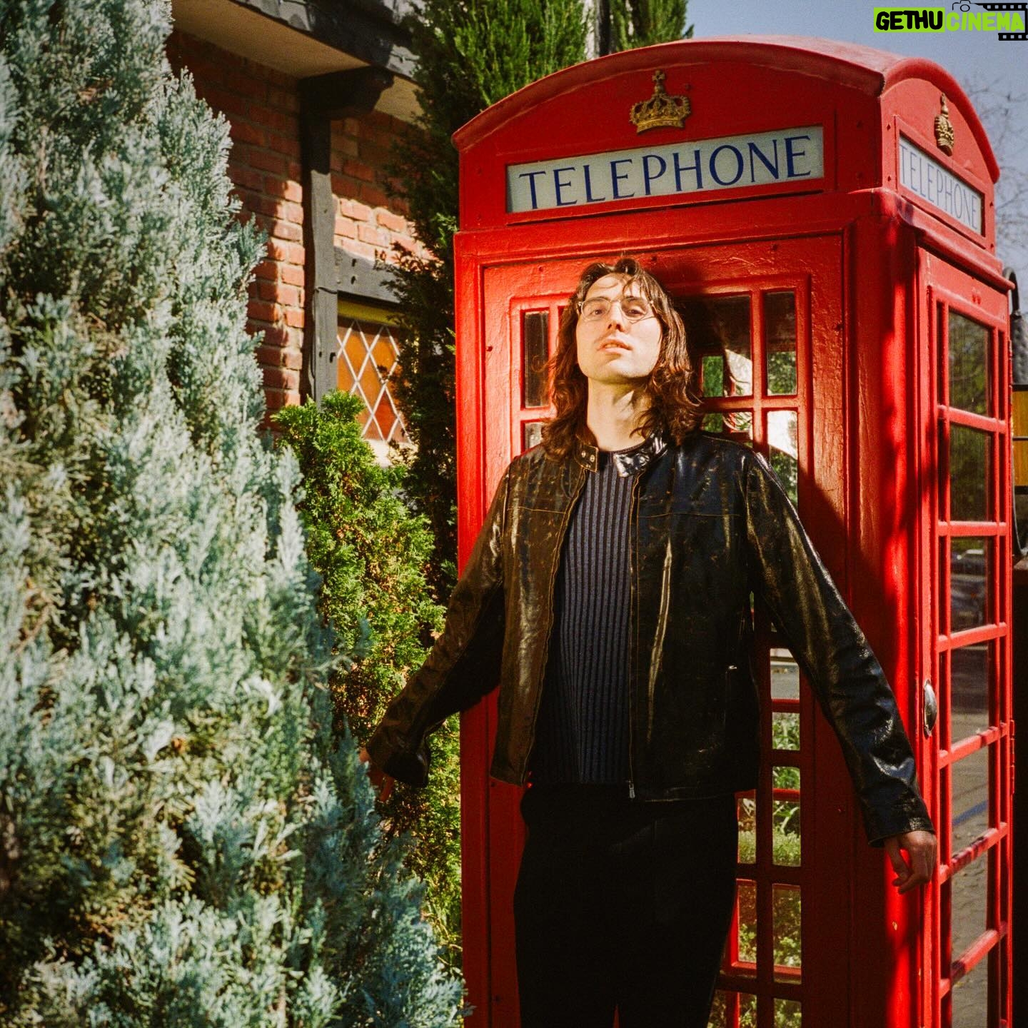 A. G. Cook - 7.2K Likes - The ultimate Britpop dork 📞 Cover feature for @readdork 📞 Photos by @strange.victory 📞 Styled by @shigecki @sofiashowandtell 📞 One of LA’s finest red telephone boxes ❤️🔥