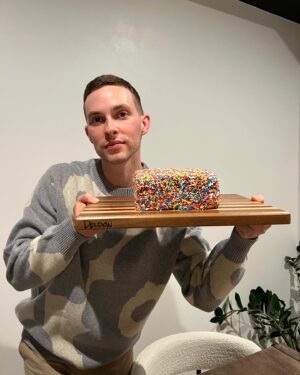 Adam Rippon Instagram - Thank you for all the birthday wishes 🥹🥹 So grateful for all the experiences of 33 and excited for all the greats things to come at 34❤️❤️❤️ 11/11/23 🎂 - also I made this cake and I’m very proud of it and all its sprinkles. I didn’t want to ruin it with birthday candles so I just created a birthday séance with bath and body works candles instead.