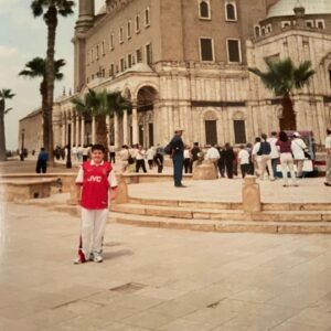 Alex Brooker Instagram - Throwback to this Lego-haired legend rocking an Arsenal shirt and white Reebok poppers in Egypt #GeezerinGiza
