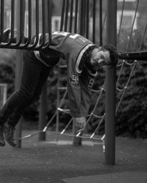 Alexander Vlahos Instagram - Spent the morning with the 📸 wizard @joelynntw - snapping away while I showed off my ice hockey collection. We sat in a children’s park for a bit, that was fun. Also snuck into a church. Both hugely successful.