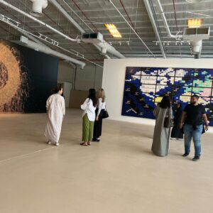 Alexandra Munroe Instagram - My God son George taking a break in the biennial beside Ahmed Mater’s work chronicling the political history of Saudi oil…and other images from the biennial and studio visits…

#diriyahbiennale2021 #riyadh #reforms @sasha.kalter #sarabinsafwan @guggabudhabi #guggenheim