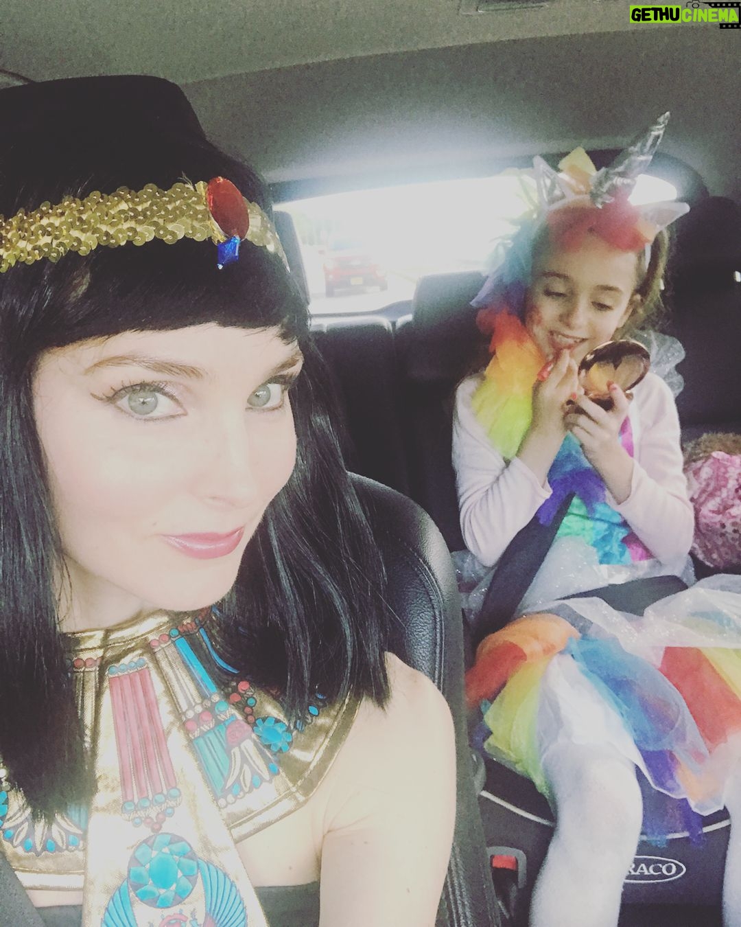 Alicia Minshew - 1.4K Likes - Bring on Halloween! Donning my Cleopatra attire as we drive to my sister's party yesterday. It was a bright and gorgeous fall day. Miss Priss is very focused on her lipstick while her sneaky momma tries to catch her in action. Trying to perfect her rainbow unicorn. She sees me and is not having it! 😝Swipe to see how she turned out. So sweet. She did it all herself! Richie's costume is a whole other post! 🤣 #earlyhalloween #falltime #rainbowunicorn #mygirl #lipstick #misspriss #cleopatra #welovedressingup #happyfall