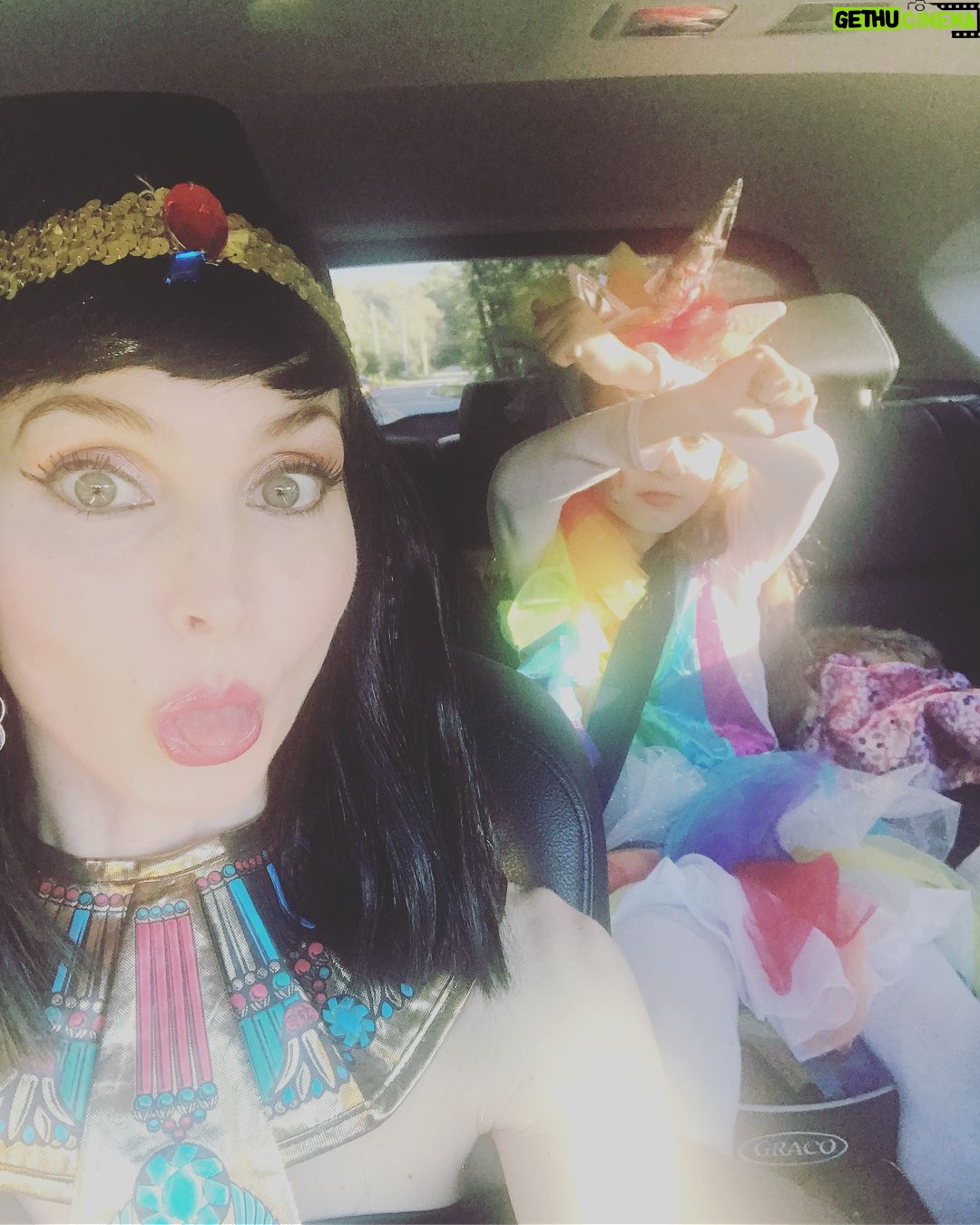 Alicia Minshew - 1.4K Likes - Bring on Halloween! Donning my Cleopatra attire as we drive to my sister's party yesterday. It was a bright and gorgeous fall day. Miss Priss is very focused on her lipstick while her sneaky momma tries to catch her in action. Trying to perfect her rainbow unicorn. She sees me and is not having it! 😝Swipe to see how she turned out. So sweet. She did it all herself! Richie's costume is a whole other post! 🤣 #earlyhalloween #falltime #rainbowunicorn #mygirl #lipstick #misspriss #cleopatra #welovedressingup #happyfall