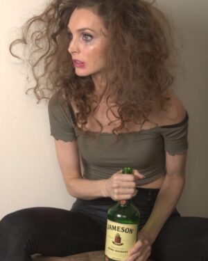 Alicia Minshew Instagram - Just a girl and her bottle. How is my makeup and hair lookin? Willow said my hair is this messy every day. #Truth. 🤪 This is inbetween shots from our crazy #murphy photoshoot. She obviously had a rough night. I myself prefer tea, but Murphy is a whiskey woman. And a hot mess. And a potty mouth. And politically incorrect. And pure fun. Just another day of making my Daddy proud...😭🤦🏻‍♀️ #comedy #projectintheworks #murphy #whiskeywoman #filthy #notforkids #politicallyincorrect #purefun #jameson #photoshoot #crazyhairday #whiskeywednesday #iprefertea