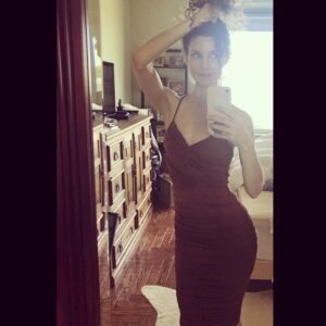 Alicia Minshew Instagram - Happy Friday! Ya know..I'm just givin a little hip action while trying on some of my fun summer dresses. I'm into brown these days...! 😬Willow is off to my left making fun of my pose and "spaghetti hair". She has a point. Why do I always make that asshole face when I look in the mirror? I am the worst at #selfies. 😏😬
#selfietime #finallyfriday #bringonsummer #summerdress #frizzyhairdontcare