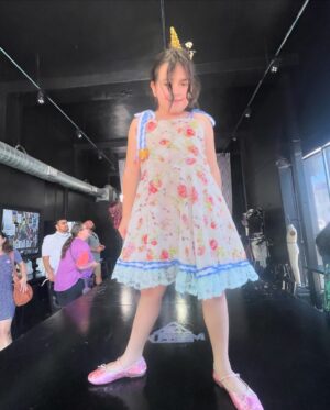 Alisha Gaddis Instagram - Gobsmacked. Indiana designed, sewed, detailed, branded and modeled this insanely gorgeous, reversible dress. 🪡 She did it all herself. I’m not going to lie - the week has been more than ups and downs. It was a lot of stimulation and unknown for our sensitive kid - but she mindfully and bravely pushed through - and because of that, she grew her craft and exploded into her passion. Check out that catwalk confidence! So thankful to @theunincorporatedlife staff of artists and makers (Ms. Summer - you have no idea how much your kindness meant to us). Sobbing the good tears over here tonight. 🩷 (Last pic is when we arrived this morning and she didn’t want to go in - so we stood on the sidewalk down the block until she was ready. My heart).