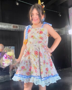 Alisha Gaddis Instagram - Gobsmacked. Indiana designed, sewed, detailed, branded and modeled this insanely gorgeous, reversible dress. 🪡 She did it all herself. I’m not going to lie - the week has been more than ups and downs. It was a lot of stimulation and unknown for our sensitive kid - but she mindfully and bravely pushed through - and because of that, she grew her craft and exploded into her passion. Check out that catwalk confidence! So thankful to @theunincorporatedlife staff of artists and makers (Ms. Summer - you have no idea how much your kindness meant to us). Sobbing the good tears over here tonight. 🩷 (Last pic is when we arrived this morning and she didn’t want to go in - so we stood on the sidewalk down the block until she was ready. My heart).