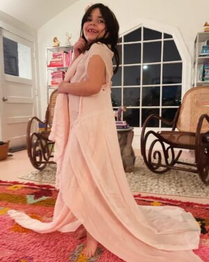 Alisha Gaddis Instagram - Indiana is next to me as I post this. She chose this very special vintage silk fabric while in Paris after seeing the YSL exhibition in Morocco. That’s when she decided fashion design was her THING!! And we are leaning in. She cut, draped and hand sewed the entire gown  herself. Here is her creation. Time to sign her up for some more lessons to fuel this fire. Thrilling as parents to see what lights your kids up. Also, I want this couture for MY next red carpet!!