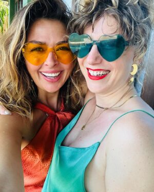 Aliyah O'Brien Instagram - Heart explosions 🧡💚💥

You know the videos of soldiers coming home from war and surprising their partners. And the partner sobs uncontrollably and can’t even look at them…

That was me when I saw @kristineilana for the first time when we reunited in Mexico after being away for 2.5 months 🙈

It wasn’t a surprise.
I was the one that went away.
And yet my heart exploded out of my eyeballs uncontrollably.
I literally turned away and couldn’t look at her for a minute.

This photo was taken days later so I look much more composed 😉
Stay tuned for a taste of the #LoveFest that was our beloved @mokanrate & @wiatlas wedding ♥️
Love of #epic proportions!!

I LOVE when love catches you by surprise and makes you feel all the juiciness of this life!!

Tag someone below who makes your heart explode 🥰

Tell your people you love them ♥️

Wishing you a life of heart explosions 💥