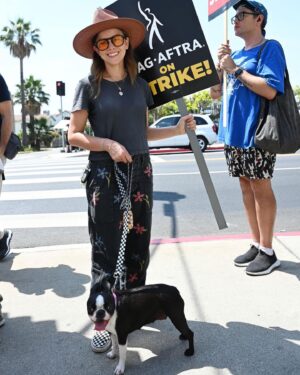 Allison Miller Instagram - We outside. I’ve been a SAG-AFTRA member for 17 years and have watched my residuals dwindle away with the rise of streaming services. I was a “recurring guest star” in 12 of 13 episodes of a very popular show on a very popular streaming service and walked away essentially losing money from every episode I worked. At the time, I fought for a slight raise considering how much work I was putting in. (12 pages of memorized legal jargon a day, traveling out of town for every episode) and the response was “We can’t do that, but we hope she’s having fun!” 🤬 And forget about ever seeing a residual from that project. This is my livelihood! I don’t need it to be fun, I need it to pay my bills!

A decade ago, residuals enabled me to survive years of unemployment due to health issues and helped me keep insurance to be able to treat those health issues. Now? There’s no way that would happen. I have been so fortunate to work so much over the last seventeen years but I’m scared of what the future holds without huge systemic change within the industry and its treatment of anyone below the 1% wealth bubble. 

This effects all of us. The brand of billionaire capitalism that is creating a greater gap between the middle class and the oligarchs running EVERY industry is disgraceful. As @dmgproductions put it so succinctly “I thought FDR fixed this…”

I’m not even broaching the topic of AI because it’s too preposterous to wrap my puny human artist brain around. So now, we’re out here. 

At least Judy is “having fun!” #sagaftrastrong #wgastrong #fairpayforlaborers