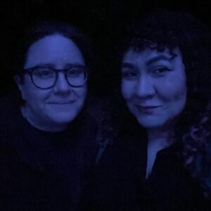 Amanda-Faye Jimenez Instagram - At a party recently, someone asked Jo if they come to all of my performances. They said yes, and described themselves as my “Dance Mom” which is very funny, but also I would not have guessed that they knew about the show Dance Moms if you had asked me.

Jo, two things among many I love about you are that you often surprise me even when the answer is unsurprising, and you let me be the funny one in public most of the time, except when it comes time to roast me, when you really just cut loose. 

Not to be obnoxious, but also recently, we were at a diner and the young gay server said we were so cute because we were holding hands across the table. I wondered if he thought we were a new couple. It suddenly felt important to me that he know we aren’t, and that such things are possible over a decade down the line, because I didn’t know that before, and I wish I had. I am so grateful I do now.

Jo, two more things I love about you are that you hold my hand a lot, and whenever I’m walking very closely behind you, my boob crashing into your back un-erotically as you are trying to navigate us to our destination, you say “why are you walking so close to me?” even though, or I guess I kinda hope because, you know I will say “I like to be very close to you! I wish I could just walk inside your skin!” And then you call me a creep, and we laugh. 

My love, thank you for holding me up somehow more than ever this past year, when I was so scared to step on stage I wanted to run, when I was literally falling over with grief. Sorry to say, but you kind of HAVE been letting me walk inside you, or maybe the other way around, but in any event, I couldn’t have stood at all without your strength, of course, but most of all the playfulness of our love. You add meaning to every moment of the day for me. Happy Valentine’s Day, I love you so! 💕💫