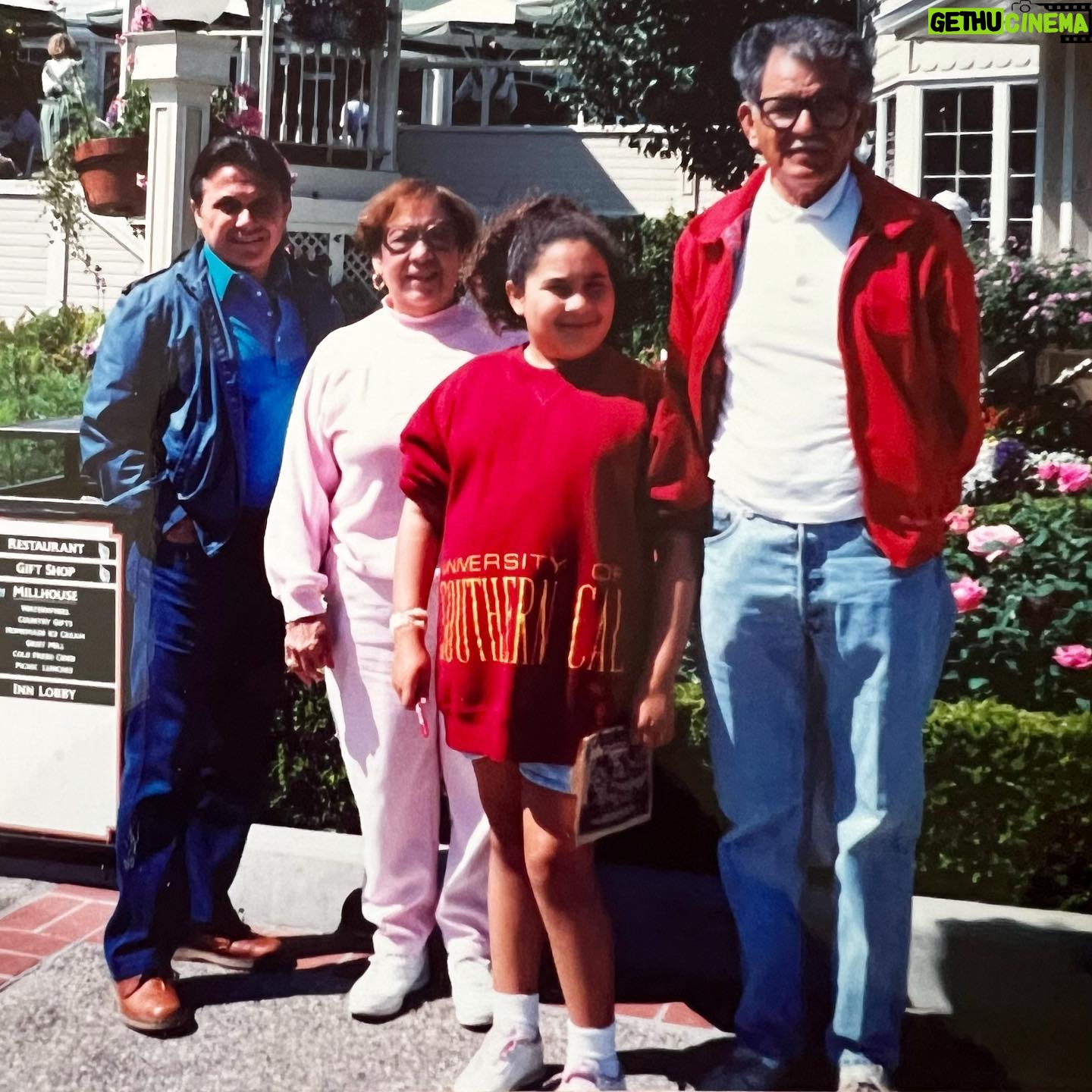 Amanda-Faye Jimenez - 3 Likes - This is me with my Uncle Adrian (Nino), Grandma, grandpa (Poppo) at the Apple Farm in San Luis Obispo in the early 90s. This trip was a happy, complicated family tradition. Complicated for me because I loved it, but there was part of me that felt out of place all the time, everywhere. I didn’t know what depression was or what it meant to feel this way so young, so it was confusing to be with people I loved so much and who I was sure loved me yet be so sad and lonely a lot of the time.
I didn’t often feel like I truly belonged to anyone or anything until much later, when I started building familial friendships, particularly queer ones.
But I am part of my family of origin, and they are part of me. My Nino (who was also my godfather) passed away suddenly a month ago. The day this happened, my whole immediate family and more were at my aunt’s house for two days, nearly around the clock. When I left to run some errands, I found myself rushing back and paused for a moment, because there wasn’t really a rush. Plenty of people were there to be with my aunt. But, I realized, I longed for them. I longed to be near them, I still do after all this time and all the necessary, often exhilarating, and just as often heartbreaking change that comes with growing up. This is because of who they are as individuals but also because of the family they built together, the home there.
My Nino was always joking around, but he was sweet and sentimental too. I will miss him as I miss my Poppo being silly and giving us little gifts we maybe didn’t deserve, and my grandma playing straight man to all these antics because, after all, someone had to, but she always gave the warmest hugs.
Feels crazy to think no one in this photo is here anymore except me, but I have plans to see my family tonight and I am excited for that, so I guess in that way, in the longing and the comfort, they actually are.