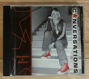 Andréanne A. Malette Instagram - Comme le temps passe vite ! 😱
Il y a dix ans, en 2014, je sortais mon « premier » album : Bohèmes. 
Mais un autre dix ans auparavant, presque jour pour jour en avril 2004, je sortais mon vrai premier album : Conversations!!! 
200 copies, vendues ici et là à mon école secondaire @collegemontsacrecoeur et au disquaire du coin. Je louais des salles, faisais des ententes avec les bars, dessinais des billets de spectacle sur paint! J’aurais tendance à dire que c’était de l’auto-production embryonnaire ! 🙊

Lève la main si tu es l’une de ces 200 personnes qui possède une copie !! 🙋🏼‍♀️