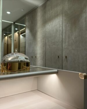 Andrés Mercado Instagram - This  Master (piece) Closet, delivered by the best @ornaremiami in suede, and gold mirrored doors, beautiful leather island, and more exquisite details when you swipe. Adding to this elegant space we have the wonderful @leebroom with his signature pendant light. This Master closet was fully  covered on a light green-goldish wallpaper, to continue this green conversation with the super comfy silky rug, as usual, @lafloreria.atelier adding elegance to the space next to this neutral white art pieces, and beautiful accessories thanks to @jonathanadler