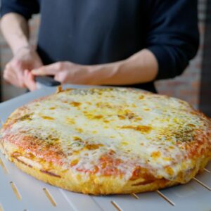 Andrew Rea Instagram - The cheese pull of dreams. On today’s Anything with Alvin, @alvin.zhou makes pizza al trancio. It’s a good reminder that sometimes a cheese pizza is all you need.  Link in the tree 🍕