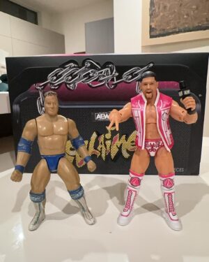Anthony Bowens Instagram - When I was a kid, I use to pretend this Rocky Maivia @therock action figure (left) was me. It was the only figure that I thought looked like me. Now I don’t have to pretend anymore. 

THANK YOU to every single person who has purchased the brand new Acclaimed 3-pack and pre-ordered my first solo figure. Seeing people unboxing these is a dream come true. 🔫🔫✂️👆#AEW