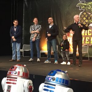 Anthony Daniels Instagram - These are the droids you’re looking for! 
Re-living some of the funnier moments of filming TROS, on stage with Brian, Dave, Lee and Hassan.
@leetowersey @brian_hezza @1_hassantaj #davechapman @comicconbrussels @tour.taxis #theriseofskywalker #yoda #iamc3po #c3po #starwars #r2d2 #bb8