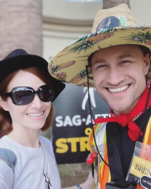 Ashley Clements Instagram - The SAG-AFTRA strike is over, having finally reached a deal after 118 days, most of which @brendanabradley spent on the front lines as a strike captain. He got up early every weekday and put his body, mind, and soul on the line, educating people through video content, organizing daily operations, keeping people safe by putting his literal body between aggressive cars and picketers (yes, there were many scary incidents), all while keeping up morale with his enormous heart and enthusiasm. It cost a lot, but he was determined to support his union and the negotiating committee by showing them that the members had their backs on the lines, members that he kept safe and energized. I am so grateful to the neg com for their work in the room, but I am especially grateful to and proud of @brendanabradley for his work in the streets❤️🎭🪧✊🏻🍍