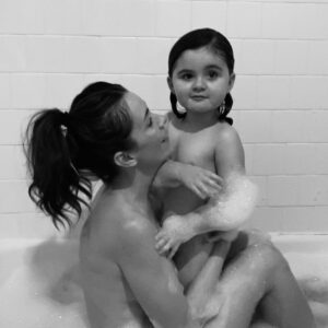 Ashlynn Yennie Instagram - Birthday Bath Pic 🛁 Holy Wow, they say it goes fast and yes, yes it does. Every year I take a birthday bath with Viv to celebrate her coming into this world … this year we barely fit in our tiny tub together, when I said smile she stuck her tongue out and there were a lot of naked Barbies that joined us 😂💓👻🥹 #mygirl #birthdaybath #tradition #waterbirth #birthdaysuit #thisisfour