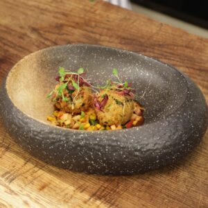 Atul Kochhar Instagram - Sharing pictures from my favourite show @saturdayjamesmartin where I made Crab Bonda dish. Show will air tomorrow, Saturday from 9.30am on @itv or you can catch up later on @itvxofficial 😊🥂

Try out this delicious dish at home with recipe shared below: CRAB BONDA

INGREDIENTS-

Picked crab meat x 400 gms
Boiled Grated potato x 300 gms
Mustard seeds x 20 gms
Curry leaves x 2 sprigs
Turmeric x 1 tsp
Chopped ginger x 1 tsp
Chopped chilli x 1 tsp
Corriander powder x 1 tsp
Lemon juice x 30 ml
Panko crumb x 250 gms
Cornflour slurry (4 tbsp cornflour   200 ml water)
Oil for frying
Salt

METHOD-

1)	In a pan, heat oil and add mustard seeds, fry till the crackling stops and add curry leaves.
2)	To this tempering, add ginger, chilli and saute for a minute.
3)	Add turmeric and coriander powder and cook for a minute.
4)	In a mixing bowl combine the crab meat, boiled potato and tempering, season with salt and lemon juice.
5)	Make 30-40 gm balls out of this mixture and chill in the fridge for an hour till firm.
6)	Dip each ball individually into the slurry and coat in panko crumb.
7)	Fry at 170 degrees for 1-2 minutes till golden brown. 

For CHILLI TAMARIND CHUTNEY
INGREDIENTS

•	Tamarind pulp - 1 kg
•	Jaggery -500 gms jaggery
•	50 gms ginger powder
•	20 gms fennel powder
•	5 gms black salt
•	10 gms cardamom powder
•	30 gms kashmiri chilli powder
•	10 gms roasted cumin powder
•	Chilli flakes -2 tsp

METHOD

•	In a pan bring tamarind pulp to a boil
•	Mix all dry ingredients with 100 ml water and whisk into tamarind pulp to avoid lumps.
•	Add jaggery and cook for 30-40 minutes on low heat till reduced.
•	Cool down and add chilli flakes.

APPLE KIMCHI SALAD
INGREDIENTS-

•	Kimchi -100 gms
•	Red apple diced - 1 pc
•	Chilli tamarind chutney

METHOD

•	In a mixing bowl add chopped kimchi and red apple, dress with chilli tamarind chutney.

CHARRED CORN
INGREDIENTS-

•	sweet corn kernels -100 gms

METHOD-

•	In a frying pan, dry roast corn kernels till charred.

*TO ASSEMBLE-
Place apple salad on the bottom, top with corn kernels.
Place crab bonda on top and dress with chilli tamarind chutney.

#atulkochhar #celebritychef #jamesmartinsaturdaymorning #saturdayjamesmartin