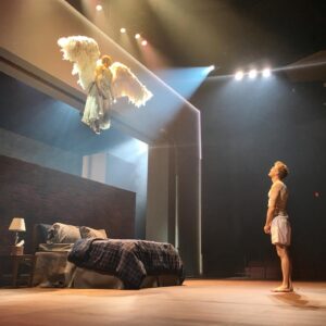 Barrett Foa Instagram - I can’t believe I’m saying this, but Angels in America, Part 1: Millennium Approaches is officially open!  This week we open Part 2: Perestroika (ya know, the weirder, longer, harder one with more angels, more ghosts, more magic, more blood, more ladders, more wrestling, more spooj, more punching, more nudity, more heaven, more hospitals, more rain, more Mormons, more dummies, more Mormon dummies, more bruises, more Bolsheviks, more prophets, more flying, and more cats!) NB: this is a rehearsal pic. Don’t worry, The Angel (the gorgeous Gina Daniels) does not wear pigtails in the show.  Think more Grace Jones ferocity! 😇👩🏾‍🎤🧚🏾‍♀️ #AngelsInAmerica #ncisla #repstl 📷: @madmakeupnhair
