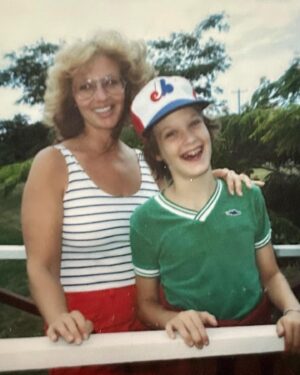 Billy Jensen Instagram - My mom suffered a massive brain hemorrhage and was rushed to the hospital this weekend. We all grabbed red eye flights to Florida Saturday night for a Mother’s Day visit we should have done anyway but she never wanted any fuss. I’ve written so much about my Dad, but my mom is the rock—always there. Being a den mother for cub scouts. Taking me to Star Wars 10 times in the theaters as a kid. Helping me get into college. Every drs appointment, dentist appointment. Every meal. The things that were just there that I took for granted. And she never ever wanted to be dependent on anyone. I collected these pics and was going to write something about her just always being there and celebrate her amazing hair styles for Mom’s day, especially as we have been bonding over 12 step. 
But now this. Sitting in her room, praying with the priests and deacons as they come by her bed. Trying to stir up energy in the universe.