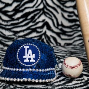 Bob Mackie Instagram - Bob Mackie recreated his iconic baseball cap design for @eltonjohn’s last dates in the US at the Dodger Stadium. 

Bob designed the original costume for Sir Elton’s concert at the stadium in 1975, and it went on to become one of Elton’s most memorable shows. Read the full article in @voguemagazine 

📷 : Ben Bentley / Rocket Entertainment
.
 #MackieMagic #EltonJohn #EltonFarewellTour #EltonLive