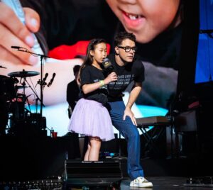 Bobby Bones Instagram - Show is doing its thing. #iheartcountry2024 rolling! On @hulu. Bringing on the stars, and helping raise money for St Jude. Shoutout to Maelin-Kate, former St Jude patient for killing it on stage!!!