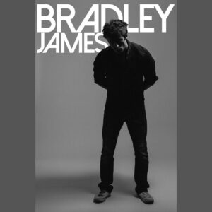 Bradley James Instagram - Forgot to put money in the meter but thankfully my name’s in big letters behind me so you can tell who it is 💡

An @sammackayphoto snap

#whoturnedoutthelights