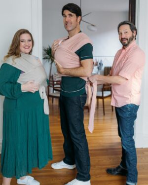 Brian Patrick Flynn Instagram - With only four weeks left, it seemed smart to dive into Swaddling and Wrapping 101 with our gestational carrier, Marissa, who’s documenting the entire surrogacy POV, process and science over at @thebellybud | Also, she’s a graphic designer by trade and designed the two dads art and the wooden midcentury building blocks if you swipe through. Also also: that’s a lifelike newborn doll named Evan nestled in the wrap to practice with, not an actual newborn baby, just in case you see it and are like wait I have a question how is there already a baby there. 📸 @kellychristinesutton @kellychristinephoto