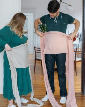 Brian Patrick Flynn Instagram - With only four weeks left, it seemed smart to dive into Swaddling and Wrapping 101 with our gestational carrier, Marissa, who’s documenting the entire surrogacy POV, process and science over at @thebellybud | Also, she’s a graphic designer by trade and designed the two dads art and the wooden midcentury building blocks if you swipe through. Also also: that’s a lifelike newborn doll named Evan nestled in the wrap to practice with, not an actual newborn baby, just in case you see it and are like wait I have a question how is there already a baby there. 📸 @kellychristinesutton @kellychristinephoto