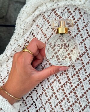 Brooke Bruk-Jackson Instagram - Living the summer dream on deck, barefoot and with the one and only summer companion 🧿🩵🐚 #brookesignaturescent 

#greece #milos #goldenhour #summerscent #fragrance