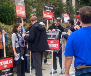 Brooke Smith Instagram - @wgawest picket line today at WB… saw this guy with the lotion sign & had to get a shot with it! #tedlasso showed up to  support, so did @_kismetcollective_ - they let protesters use their bathroom, gave out free water & coffee, and the guy on the motorcycle kept spirits up! @sagaftra