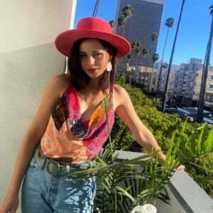 Brooke Williams Instagram - I got a new hat and mum made me pose in it on my balcony and I got really grouchy and embarrassed but then I liked the photos lol so here is one. Happy, happy summer!✨✨✨