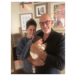 Caitlin McGee Instagram - She looks so teeny in Grandpa’s big mitts 😭. How lucky am I to have family to support this truly bonkers transition into parenthood.