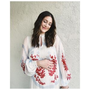 Caitlin McGee Instagram - This hasn’t been an easy pregnancy, I feel very grateful to be in a place now where I can dress up and leave the house. And after this week, I just feel grateful. Can’t stop holding my belly and telling this little bunny how loved she is 🐰
.
.
.
Thank you for making me feel like a queen 💫@nataliehoseltonstyle @kendalfedail @mashyourhair