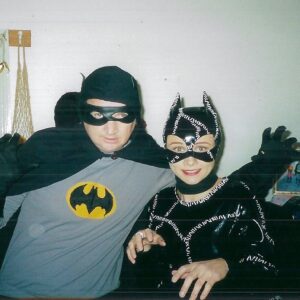 Cal Wilson Instagram - From Cat Lady to Cat Woman….
@damiancallinan has been finding photos from Skithouse times. Look at the embryonic people from the olden days. 
(I think this is from a sketch where Catwoman has been going through Batman’s bins and using his garden as a litter tray)

#skithouse #comedy #AustralianComedy #CatWoman #BatMan

(Image: Damian, a man, and Cal, a woman, have sided animal qualities to themselves to become Batman and Catwoman. Damo’s Batman costume is rumpled and his mask is wonky. It’s more Original Batman, than gritty reboot Batman.  He has his arms stretched out. 
Cal’s Catwoman suit is shiny black vinyl with  pretend stitching. Under her mask you can see some extremely early 2000’s eyebrows. She has her paws up like a half hearted cat. Hands. She has her hands up)